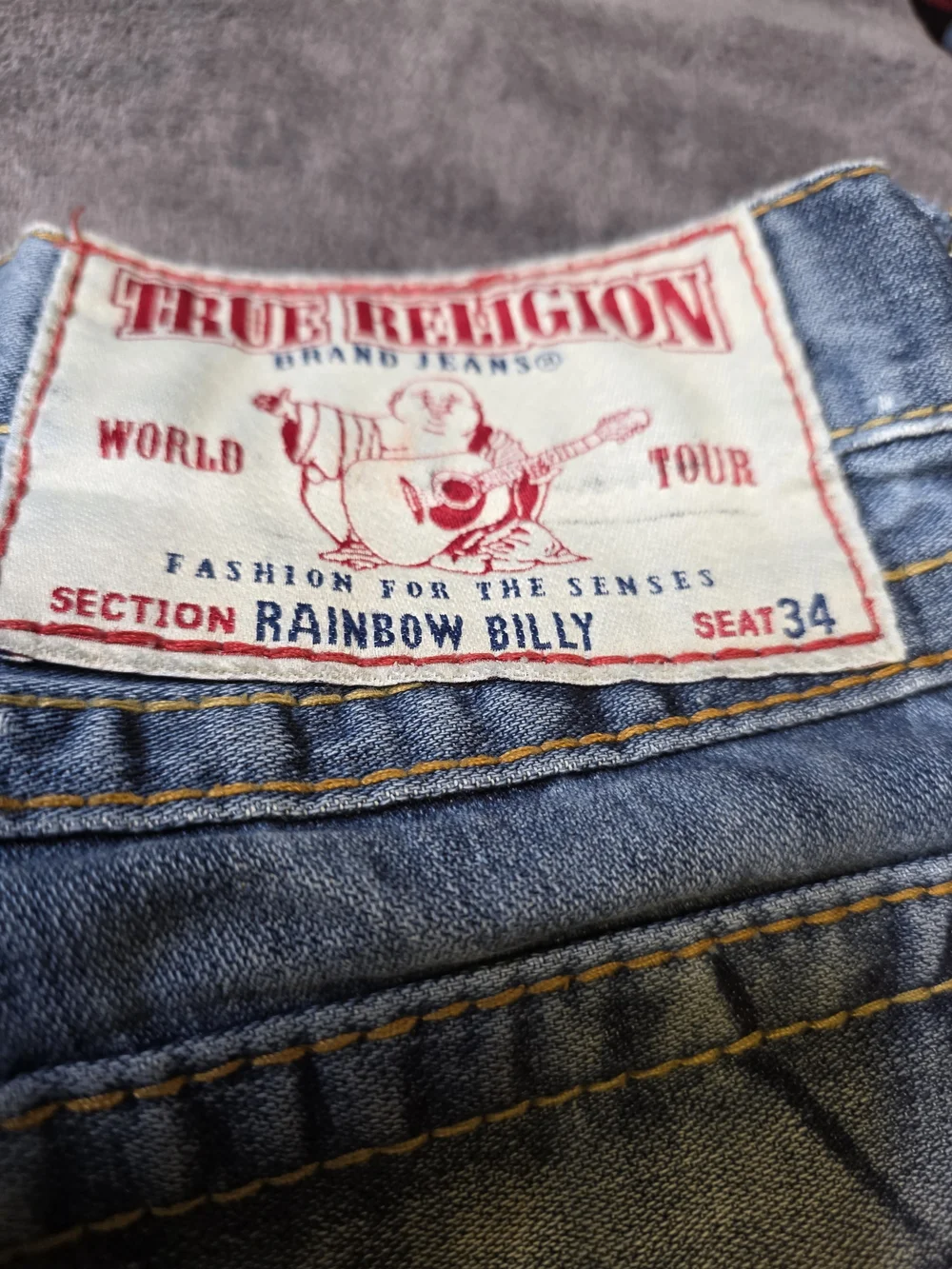 TRUE RELIGION Light Wash Cutoff Denim Shorts with Embroidered Back Pockets